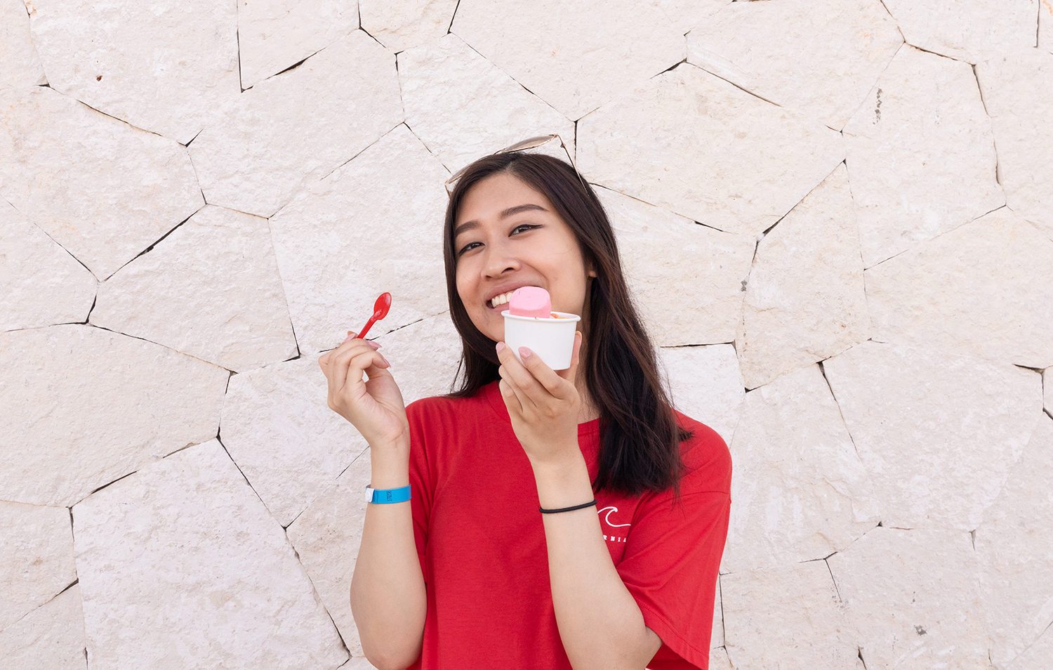 Portrait of Rebecca Lu with an ice cream in hand